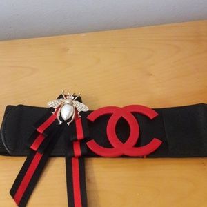 Red and black brooch with butterfly